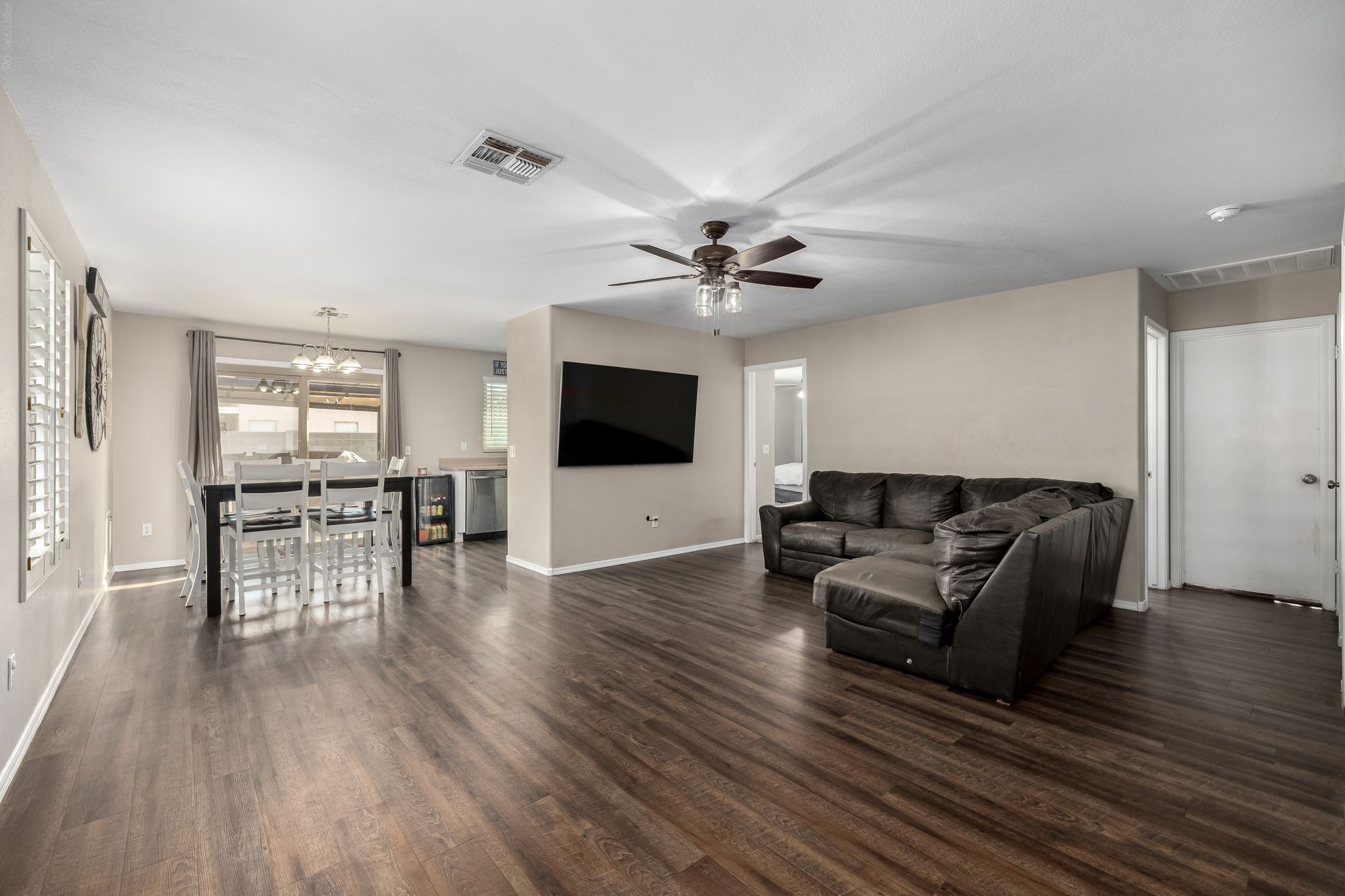 Living room with wood-look floors and a sectional sofa